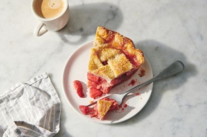 Pie with a forkful turned over to show browned bottom crust